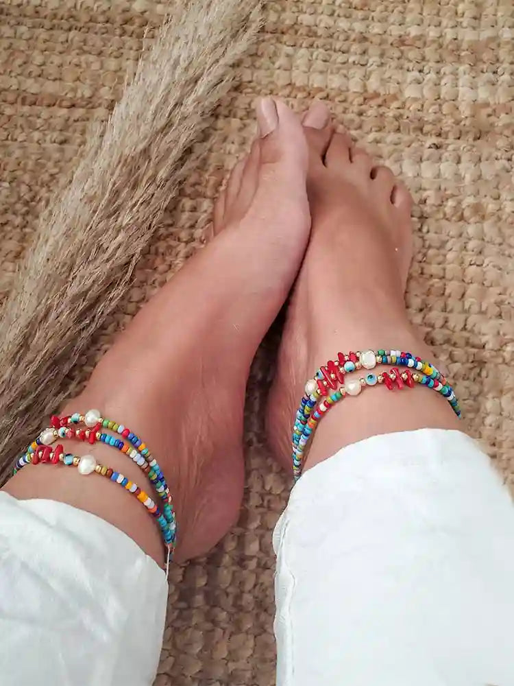 Discover the vibrant charm of the Ava Multicolour Anklet. A playful and colorful accessory that brings a splash of joy to any ensemble. This delightful anklet combines the whimsy of multicoloured plastic beads with the elegance of 18K gold-plated stainless steel charms, creating a piece that’s as versatile as it is beautiful.