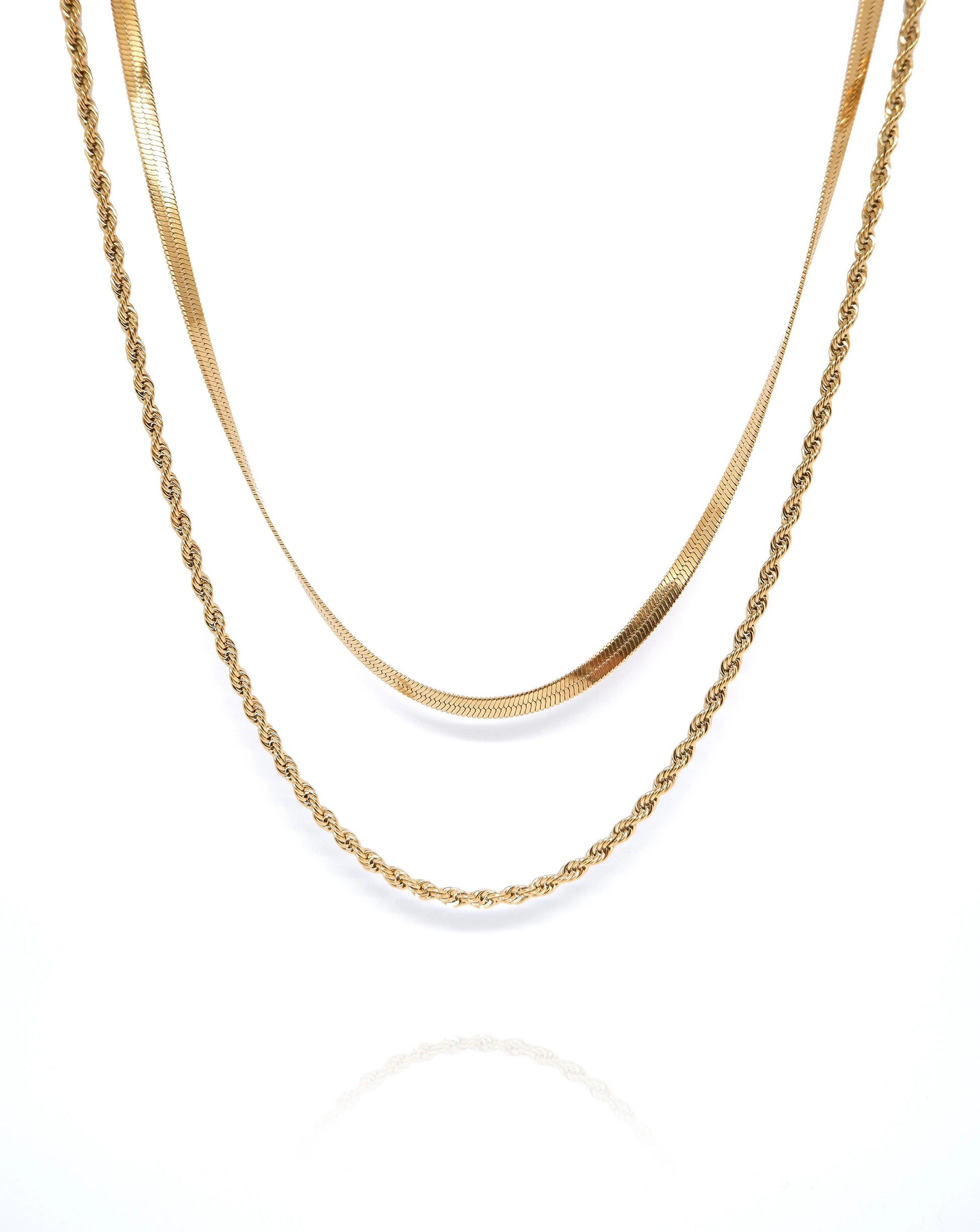 The Penelope Double Layer Necklace is an exquisite piece of jewellery that effortlessly combines sophistication with modern elegance. This stunning accessory features a double chain design, each plated with lustrous 18k gold, radiating a luxurious and timeless charm. It is a perfect choice for special occasions such as birthdays, Valentine's Day, or any celebration of love and elegance. 