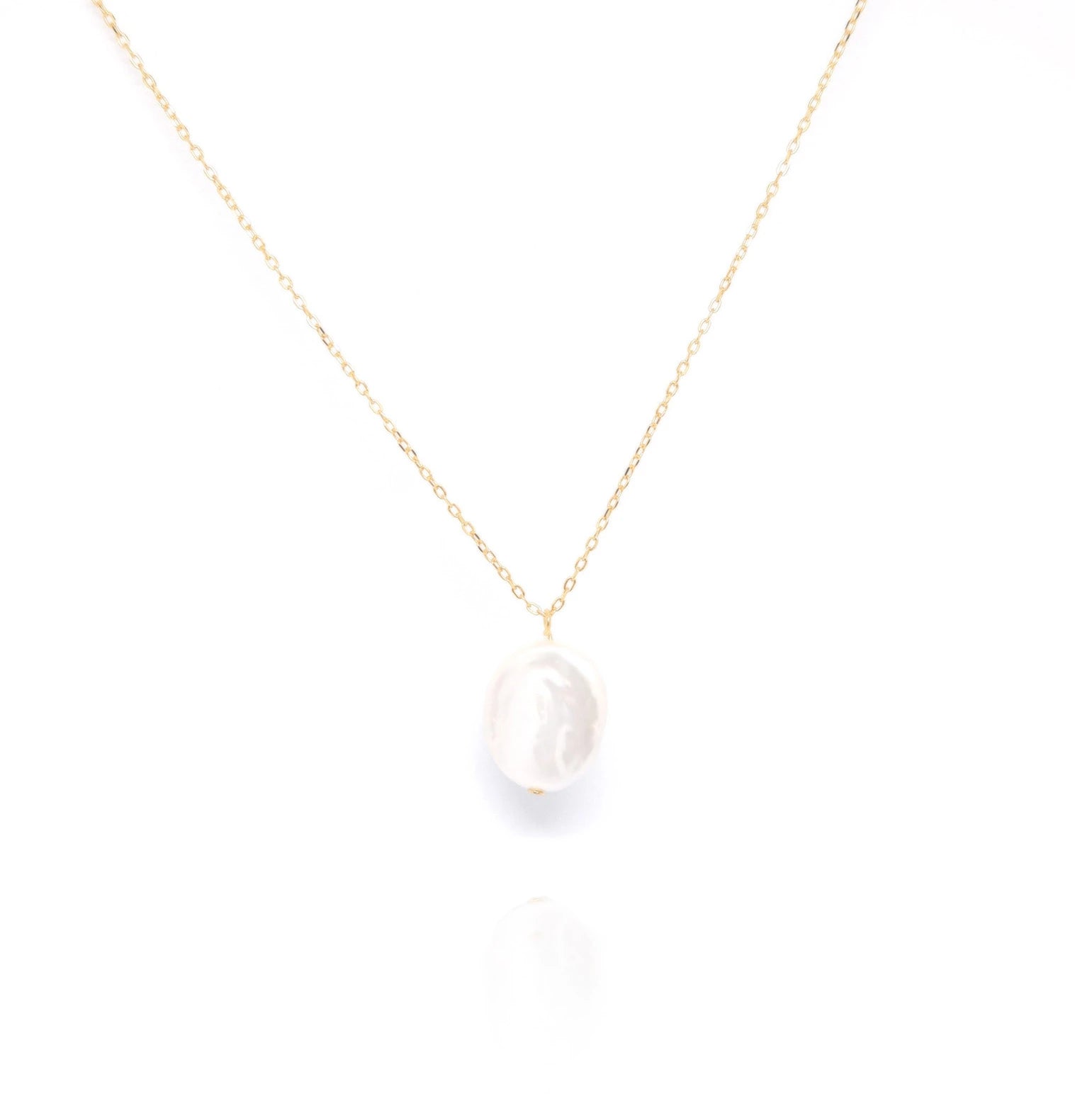 Our Keshi Flat Pearl Necklace is a timeless and elegant piece designed to enhance the natural beauty of the wearer. This exquisite necklace seamlessly blends sophistication with simplicity, making it the perfect gift for any occasion, whether it's a Valentine's, birthday, anniversary, graduation, or a meaningful milestone.